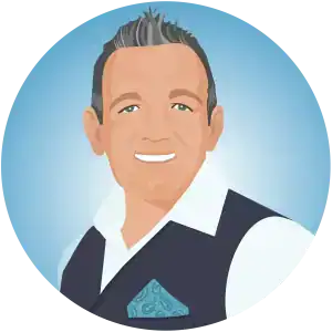 A digital illustration avatar of Robert Lewis, co-founder of Kooky Kids World. Robert is a former teacher and the narrator for the site's stories, shown in a professional waistcoat and white shirt with a blue circular background.